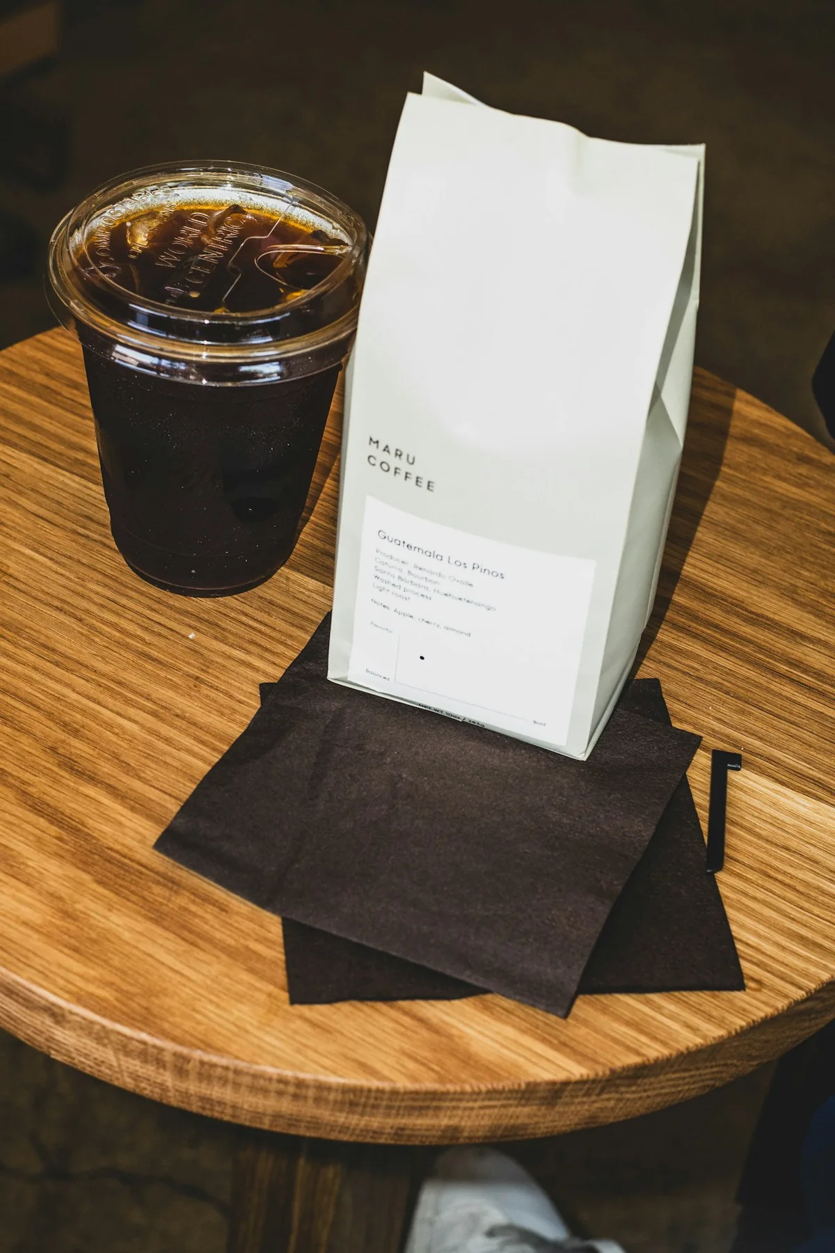 Iced coffee and a bag of Maru Coffee beans at the Hillhurst Avenue café
